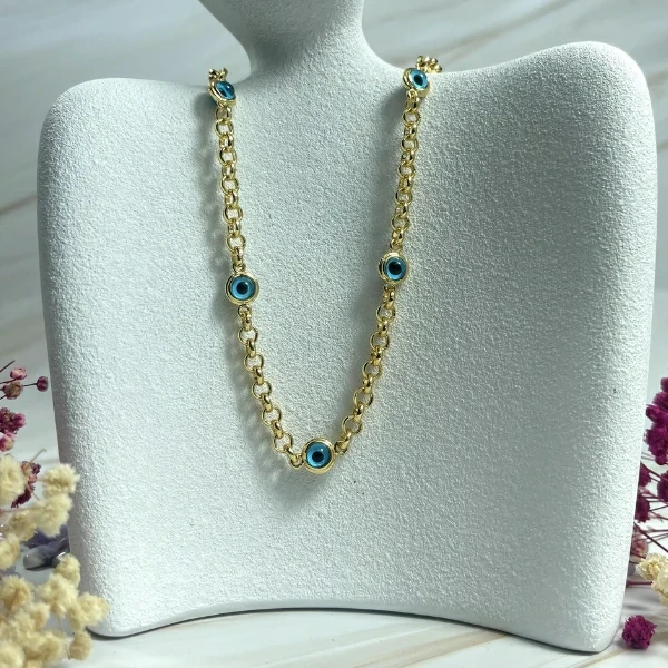 Yellow Gold Necklace Adorned with Round Blue Stones Like a Gemstone in Eyes Shape